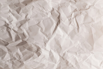 Crumpled white paper background.