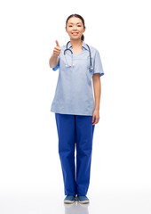 medicine, profession and healthcare concept - happy smiling asian female doctor or nurse in blue uniform with stethoscope over white background