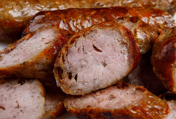 Pieces of chopped homemade fried sausage. Home sausage.