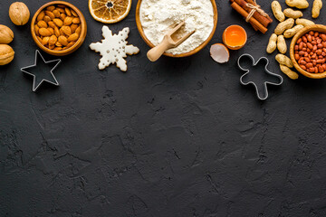 Cooking background with icing gingerbread cookies for Christmas, top view