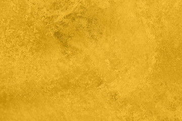 Obraz na płótnie Canvas Saturated yellow colored low contrast Concrete textured background with roughness and irregularities. 2021 color trend.