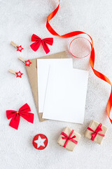 Merry Christmas greeting card on white background with red decor. Flat lay composition with copy space. - 393565439