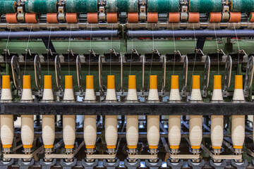 old spinning machinery working at an old textile factory