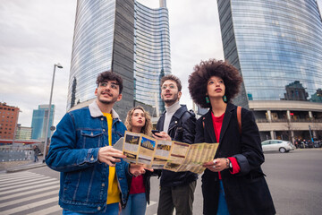 Group of foru friends traveler consulting guide map planning holiday outdoors visiting city