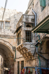 Decorative  stone external balcony on the wall of a building on the Shaar ha-Shalshelet Street in the old city of Jerusalem in Israel