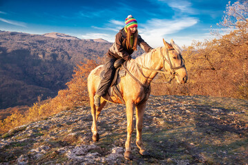 Woman and horse, landscape autumn