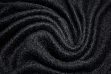 Fototapeta na wymiar Black or dark gray satin silk fabric texture. Luxurious shiny abstract cloth background or pattern for design.