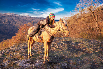 Woman and horse, landscape autumn