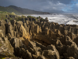 The Pancake Rocks are a heavily eroded limestone area where the sea bursts through several vertical...