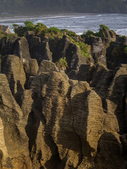 The Pancake Rocks are a heavily eroded limestone area where the sea bursts through several vertical...