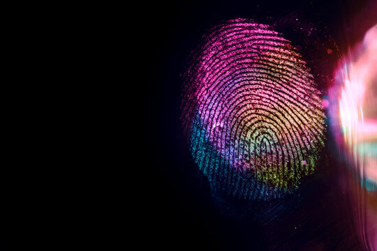 Close up beautiful abstract multi colored fingerprint on  background texture for design. Macro photography view.