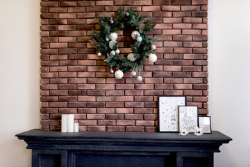 Christmas wreath over the fireplace. New Year, Christmas concept.