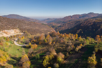 Fototapeta na wymiar Autumn colors above the Romanian village, in Gorj county