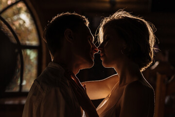 a young couple in love in the dark. happy relationship and passion between a man and a woman