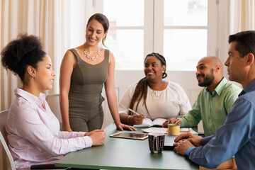 Confident business woman collaborating and discussing project plans in the office. Communication, cooperation, brainstorm concept..