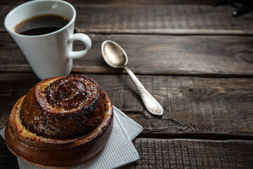 Morning still life of hot fresh home baked buns and coffee
