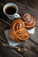 Morning still life of hot fresh home baked buns and coffee