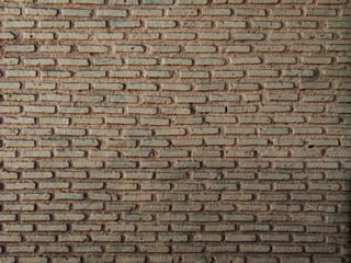 Old and rough brick mix concrete wall background.