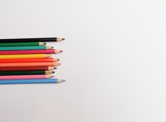 Set of neatly arranged arrangement of colored pencils.  Isolated on white background.