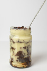 mason jar with vanilla and chocolate dessert 