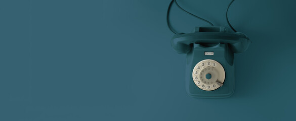 A blue vintage dial telephone with blue background.
