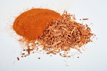 Catuaba bark and catuaba powder on white background. Natural herbal tea from Catuaba tree bark,...