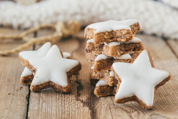 Pile of christmas cinnamon star cookies on wooden table, closeup