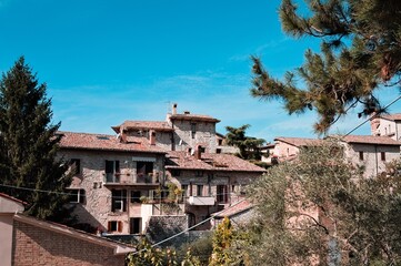 Fototapeta na wymiar Front view of a traditional italian brick house of a medieval village (Gubbio, Italy, Europe)