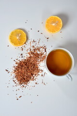 Cup of tea, Catuaba bark and lemon on white background. Natural herbal tea from Catuaba tree bark,...