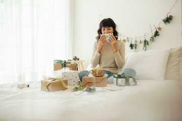 Woman cherishing her christmas gifts and letters
