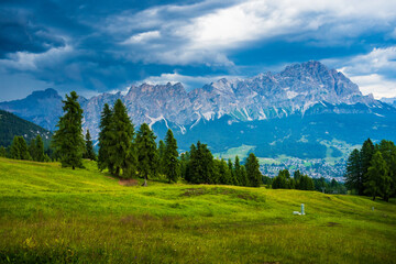 Obraz premium Beautiful alpine countryside. Scenic image of famous Sassolungo peak with overcast perfect blue sky. Wonderful Vall Gardena under sunlight. Majestic Dolomites Mountains. Amazing nature Landscape