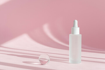Serum oil with collagen and peptide in white transparent bottle with dropper on pink decor backdrop with shadows. Skincare beauty treatment medical skincare mockup packaging liquid cosmetic product