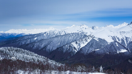 Fototapeta na wymiar Panoramic view on high snowy mountains in winter at sunny day. Caucasus Mountains, Mount Ushba. Svaneti region of Georgia