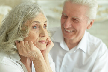 Close-up portrait of happy senior couple posing