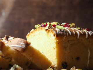 Close up pistachio and cranberry on top of butter pound cake