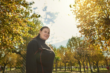 Active senior woman doing healthy exercises outdoors. Jogging