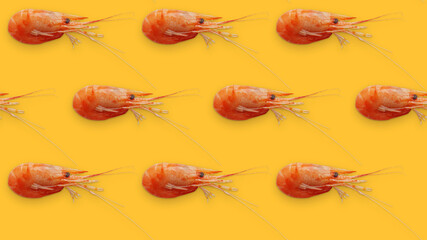 Juicy fresh shrimp seamless pattern isolated on yellow background. Place for your text. Shrimp seamless pattern on a yellow background. Seafood shrimp background texture.