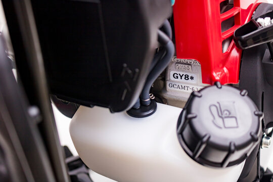 Fuel tank cover of Honda UMR 435t grass trimmer isolated