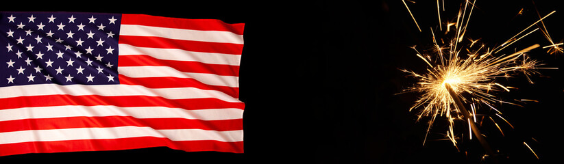 Fototapeta premium American Celebration - United States, Usa flag flowing in the wind and burning sparkler firework on black web banner background. American flag for Memorial Day, July 4th, Labor Day concept. copy space