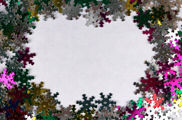 White background with small multicolored snowflakes