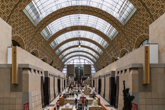 Paris, France - July 5, 2018: Visitors at the Musee d'Orsay in Paris. Located in the former Gare d'Orsay train station, the museum has the largest collection of impressionist paintings in the world.