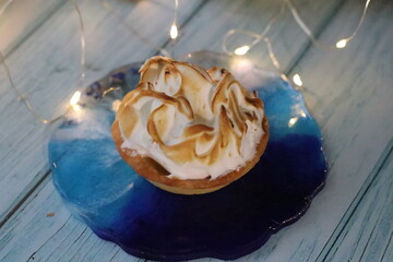 A chocolate cake sitting on top of a wooden table