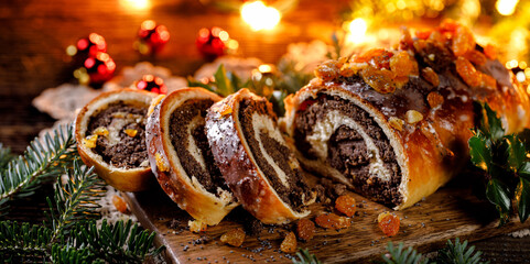Christmas poppy seed cake, sliced poppy seed cake covered with icing and decorated with raisins on...