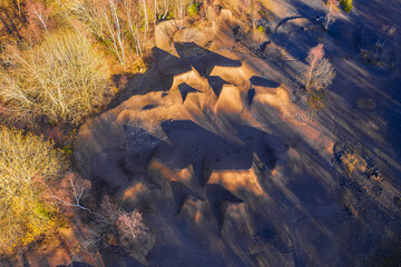 a dirt bike park in autumn from above