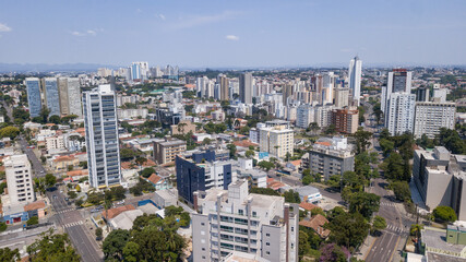 Fototapeta na wymiar Drone image taken which shows a panoramic view of the Alto da XV neighborhood in Curitiba, capital of the state of Paraná, Brazil, with its buildings and trees