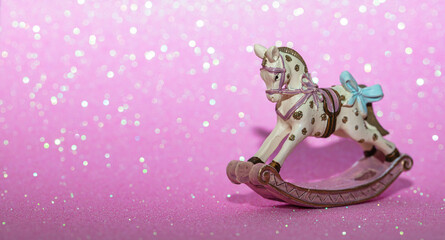 rocking horse christmas toy on pink background