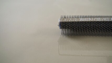 Charcoal roller on the self-leveling floor. Charcoal roller. Self-leveling floor tool....