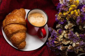 french breakfast coffee with croissant and flowers on a beautiful background