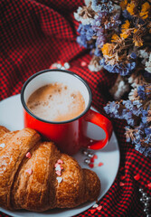 french breakfast coffee with croissant and flowers on a beautiful background