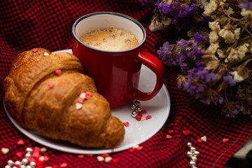 french breakfast coffee with croissant and flowers on a beautiful background